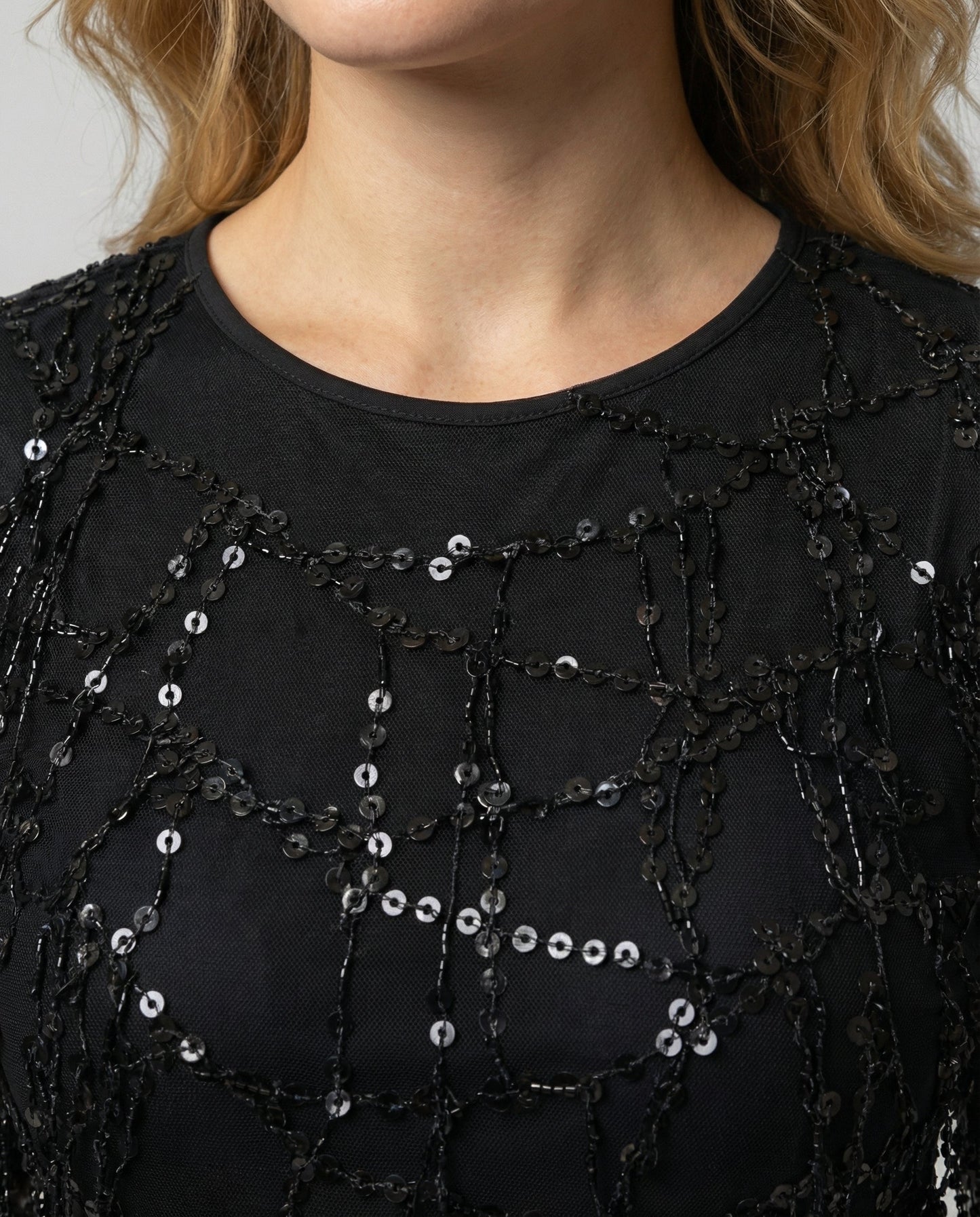 fringe sequin dress with elegant statement silhouette and shimmering finish