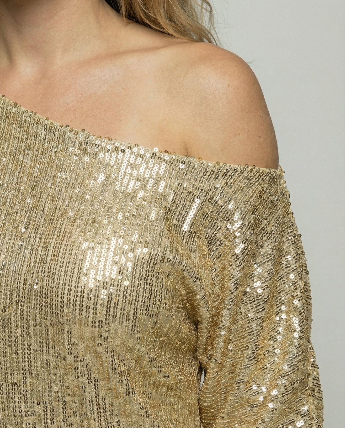 one shoulder mini dress with shiny finish and statement silhouette