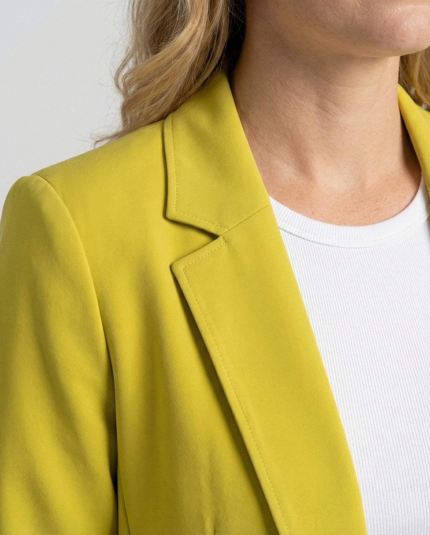 slim-fit blazer with tailored structured design and classic button front